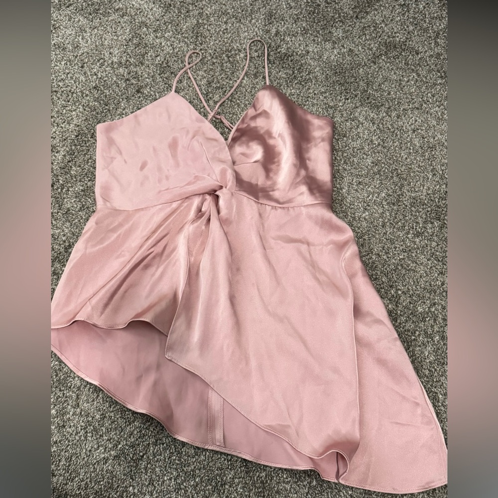 Size medium tank from Express. Sliky light pink. Side angle cut on bottom.
